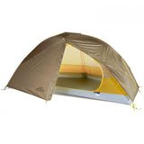 A Mont Moondance 1 Tent, featuring a dome shape in brown and yellow, has its entrance open, revealing an interior with a grey floor. This lightweight tent is ideal for solo adventurers, with the brand "Mont" clearly visible on the side.