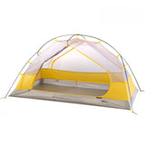 A lightweight, 3-season Mont Moondance 2 Tent designed for two people, featuring an exposed mesh design and a yellow rainfly.