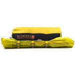 Yellow and black, the Mont Moondance 2 Tent is a two-person, three-season lightweight tent in a compressed state for transport.