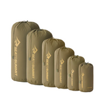 A set of six Sea to Summit Lightweight Stuff Sacks in olive green, crafted from durable nylon and water-resistant materials, arranged in order from largest to smallest.