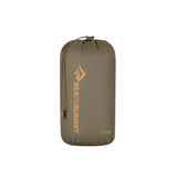 A khaki-colored cylindrical Sea to Summit Lightweight Stuff Sack made from durable nylon with a drawstring top, featuring the "Sea to Summit" logo and text in yellow. Water-resistant for added protection during your adventures.