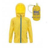 The Mac in a Sac Mini Mac Rain Jacket, featuring a yellow design with blue zipper and drawstrings, is shown alongside its compact carrying pouch labeled with the brand "Mac In a Sac." This breathable and waterproof jacket is ideal for unpredictable weather and can be easily packed away when not needed, offering both style and practicality.