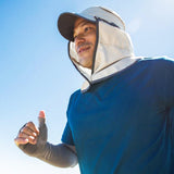 A man wearing a Sunday Afternoons Sun Guide Cap, providing UPF50+ protection, while running.