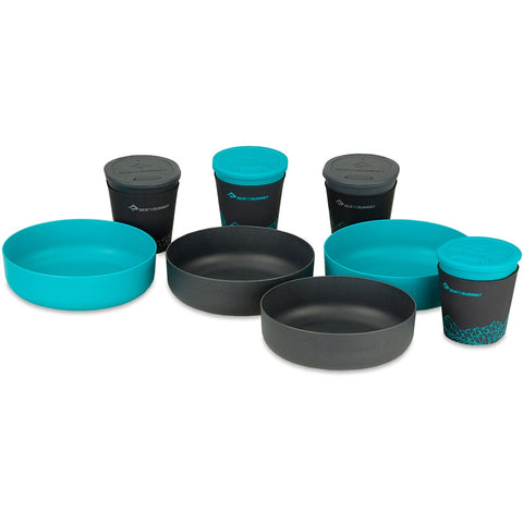 A set of Sea to Summit DeltaLight Camp Set 4.4 including two plates, three bowls, and two cups in black and teal with lids.