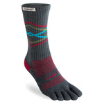 The Injinji TRAIL Midweight Crew is a gray toesock with red and blue patterns, branded "Injinji" near the top and foot. Its individual toe compartments make it ideal for trail running and blister prevention.