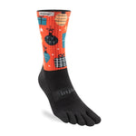 A colorful Injinji SPECTRUM TRAIL Midweight Crew with an orange upper featuring holiday-themed illustrations of gifts and ornaments, and a black lower part with individual toe compartments. Made with COOLMAX® fibres, it offers exceptional comfort and blister prevention for festive fun.