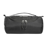 A cylindrical black Tatonka Care Barrel Wash Bag, featuring a hanging hook for easy access, a top carrying handle, and dual front zippers.