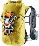 The Deuter Vertrail 16 by Deuter is a yellow alpine pack with adjustable straps, black lining, side pockets, trekking pole holster, and orange crampons secured to the front with elastic cords.