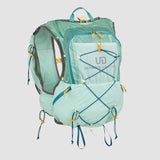 A light turquoise Ultimate Direction Mountain Vesta 6.0 backpack with yellow drawstrings features the brand logo and ample storage for essentials, including trekking pole carry options and multiple compartments, making it perfect for adventures.