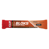 Clif Shot Blocks Energy Chews by clif, orange flavor with 25mg caffeine per 2.12 oz (60g) pack, provide carbohydrates for quick fuel and electrolytes to help replenish during activity, with product branding and details on the package.