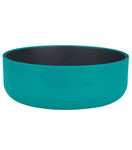 A teal Sea to Summit DeltaLight Bowl Set, featuring a black interior, crafted from BPA-free polypropylene and designed for outdoor use.