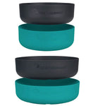 Four stackable Sea to Summit DeltaLight Bowl Sets in black and turquoise colors, featuring the "Sea to Summit" logo. Crafted from BPA-free polypropylene, these lightweight dinnerware pieces include two black bowls stacked above two turquoise ones.