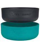 Two Sea to Summit DeltaLight Bowl Sets stacked vertically. The top bowl is black and the bottom bowl is teal, both made from BPA-free polypropylene. Each lightweight dinnerware piece features the Sea to Summit logo, perfect for your camping adventures.