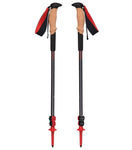 A pair of red and black Black Diamond Pursuit Shock Trekking Poles with ergonomic cork grips, Bloom grip extensions, and wrist straps, designed for outdoor hiking by Black Diamond.