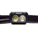 Close-up of the Black Diamond Onsight 375 Headlamp featuring two LED bulbs in a dual-beam configuration, mounted on an adjustable fabric strap. Ideal for climbers, this Black Diamond headlamp boasts a waterproof design to ensure reliability in all conditions.