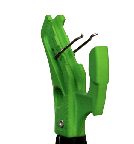 A close-up of the Betastick BetaStick Evo Super Standard, a green tool with two metal prongs and a textured handle, resembling a compact reach remote clipping device, photographed against a white background.