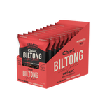 A red box displays multiple packs of Chief Beef & Chilli Biltong by Chief Nutrition, an organic, grass-fed, preservative-free snack. This healthy treat is slow air-dried to perfection for flavorful enjoyment.
