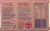 The back of a Crafty Weka Bar 75g box with a label on it, featuring outdoor snacks and sustained energy.