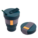 The Hunu Collapsible Cup by Hunu is a BPA-free dark green travel cup with a leak-proof lid, straw, and gray fabric grip, shown both expanded and folded.