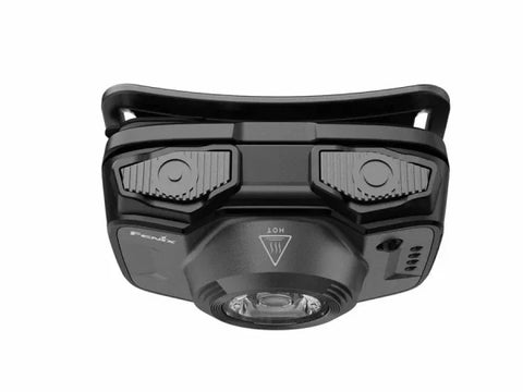 The Fenix Lighting HL12R V2.0 is a black, lightweight rechargeable headlamp with SST20 white & 2835 red LEDs, dual adjustment knobs, a central lens, and a "HOT" warning symbol above the lens.