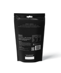 A black resealable pouch of outdoor gourmet’s Coconut Lime Chicken - Heat & Eat Meal displays product info, nutrition facts, a QR code, and cooking instructions—with a zesty kaffir lime hint—ideal camping food.