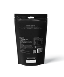 A black stand-up pouch labeled "Offgrid Loaded Dahl - Heat & Eat Meal" from Offgrid, with vegetarian lentil dahl details, nutritional info, and preparation instructions on the back.