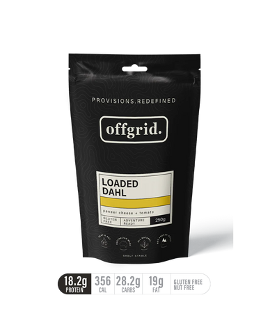 A black pouch labeled "Offgrid Loaded Dahl - Heat & Eat Meal" by Offgrid—a gluten-free lentil dahl with 18.2g plant-based protein, 356 cal, 28.2g carbs, 19g fat per 250g serving.