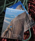 The "Mount Buffalo Climbing Guidebook 2 Vol. Set" by Crash Dog Publications showcases climbers on rock faces, with both volumes displayed. The cover of the front book reads "6th Edition, 2023, Volume 1 - The Gorge," and a rope is visible in the background. This guidebook set by Steve Toal is perfect for climbing enthusiasts.