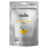 A silver package labeled "Radix Original 600kCal Meals" from Radix highlights its plant-based and gluten-free qualities. This ready-to-eat, mild Indian curry meal includes chickpeas, quinoa, vegetables, and herbs. The freeze-dried meal has a net weight of 133g.