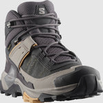 The Salomon X Ultra 5 Women's Hiking MID by Salomon is a gray and black boot with yellow accents, rugged Contagrip tread, mesh fabric, and supportive ankle padding—your perfect hiking companion for any trail.