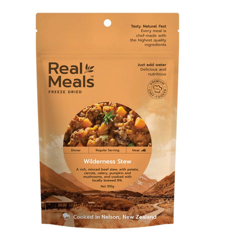 A package of Real Meals Wilderness Stew, showing the hearty stew and product info on an orange and beige background.