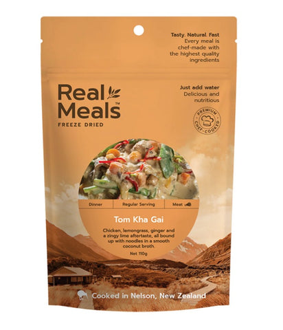 A package of Real Meals - Tom Kha Gai by Real Meals, showing lemongrass chicken noodles in coconut broth on a tan background, with product info and preparation instructions included.