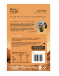 Back of a Real Meals - Tom Kha Gai freeze-dried meal package displays prep instructions, nutrition facts, and company info with mountain graphics and outdoor imagery featuring lemongrass chicken noodles in coconut broth.