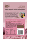 Back of a Real Meals - Chocolate Cake Pudding package, featuring prep instructions, product details, nutrition facts, and a photo of a man savoring rich chocolate cake pudding topped with creamy chocolate sauce.