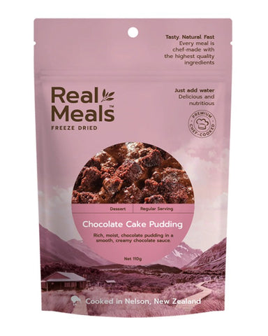 A pink packet of Real Meals - Chocolate Cake Pudding, by Real Meals, displays an image of moist chocolate cake pudding covered in creamy chocolate sauce, along with product details on the front.