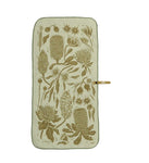 The Mont Flora Microfibre Travel Towel by Mont is a beige towel adorned with green botanical illustrations, showcasing a variety of flowers and leaves, laid flat with a hanging loop on the side. Made from recycled polyester for fast drying, this elegant piece embodies the practicality of microfibre travel towels.