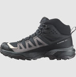 The Salomon Women's X Ultra 360 GTX MID, available in black and grey, is a high-top hiking boot designed for outdoor enthusiasts. It features a rugged outsole, reinforced toe, Gore-Tex waterproof protection, lace-up closure, and an ankle collar for added support.