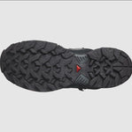 The underside of the Salomon Women's X Ultra 360 GTX MID hiking shoe sole is shown, featuring deep, multidirectional treads, All Terrain Contagrip technology, and a small red triangular detail in the center—perfect for outdoor enthusiasts.