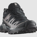 Close-up image of the Salomon Women's X Ultra 360 GTX, a black and grey athletic hiking shoe with a prominent "S" logo on the tongue and rugged sole, perfect for outdoor enthusiasts.