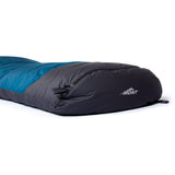 A blue and black Mont Brindabella 700 sleeping bag lies flat, showcasing its visible zipper and a "Mont" logo near the foot end. Made from Hydronaute XT fabric, this down sleeping bag promises exceptional comfort in the great outdoors.