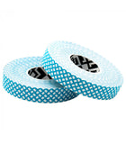 Two rolls of Crux Power Climbing Finger Tape by Crux Climbing, in a blue and white pattern, are stacked on their sides and offer durable adhesive for dependable finger protection.