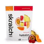 The Skratch Labs Sport Hydration Drink Mix 440g in fruit punch flavor showcases sliced fruit pieces from the start, delivering a refreshing burst with electrolytes and low sugar content.