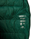 A close-up view of the Mont Zodiac 700 Sleeping Bag in green, featuring printed text with various specifications such as temperature ratings and insulation details. The recycled Nylon shell highlights its eco-friendly design, making it ideal for cold weather camping.