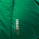 Close-up of a green Mont Zodiac 700 Sleeping Bag by Mont with the text "ZODIAC 700" and "Standard Left Hand Zip" printed on it, perfect for cold weather camping.