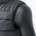 Close-up of a black mannequin wearing the 3 Peaks Men's Down Vest, showcasing its black quilted sleeveless design with visible stitching and a high collar. This vest offers a high warmth-to-weight ratio and features durable water repellent for added protection.