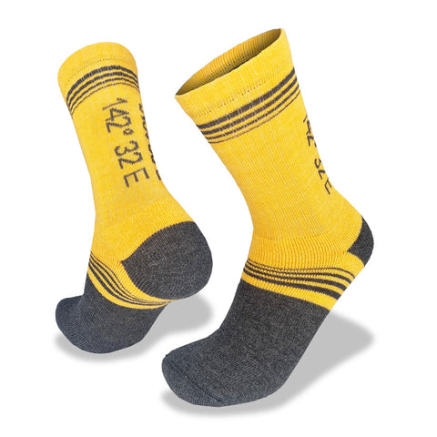 A pair of yellow and gray Wilderness Wear Grampians Peaks Hiker crew socks designed with extra padding and size markings.