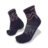 The Wilderness Wear Atmosphere Q Trail Socks by Wilderness Wear are navy blue with light gray geometric patterns and "WILDERNESS" on the cuffs, featuring moisture management to keep your feet dry and comfortable on adventures.
