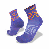 Two purple Wilderness Wear Atmosphere Q Trail Socks with orange and white geometric patterns, featuring the brand name "Wilderness Wear" on the cuffs, are designed with blister-preventing Climayarn technology.