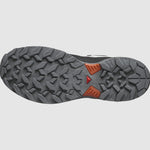 An image of the sole of the Salomon Men's X Ultra 360 GTX hiking shoe, featuring a textured, rugged tread design with gray and orange color elements, enhanced by Salomon's Contagrip technology.