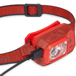 A Black Diamond Storm 500 Rechargeable Headlamp with a USB cable for outdoor lighting.